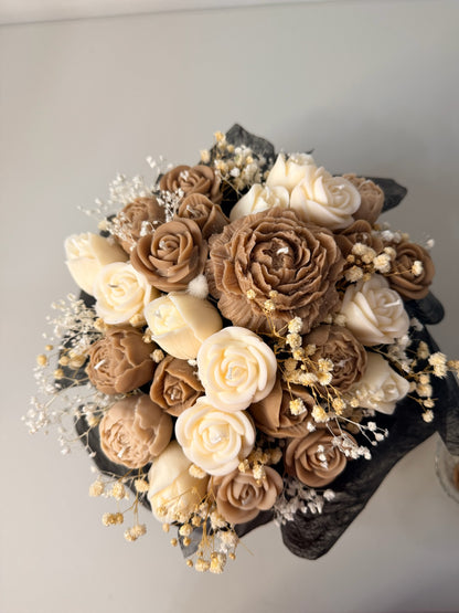 Bouquet of brown and beige flowers with dried elements on a light gray background